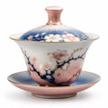 Teetasse mit Deckel und Untertasse im Kirschblütendesign, Rosa/Blau/Weiß, 150ml